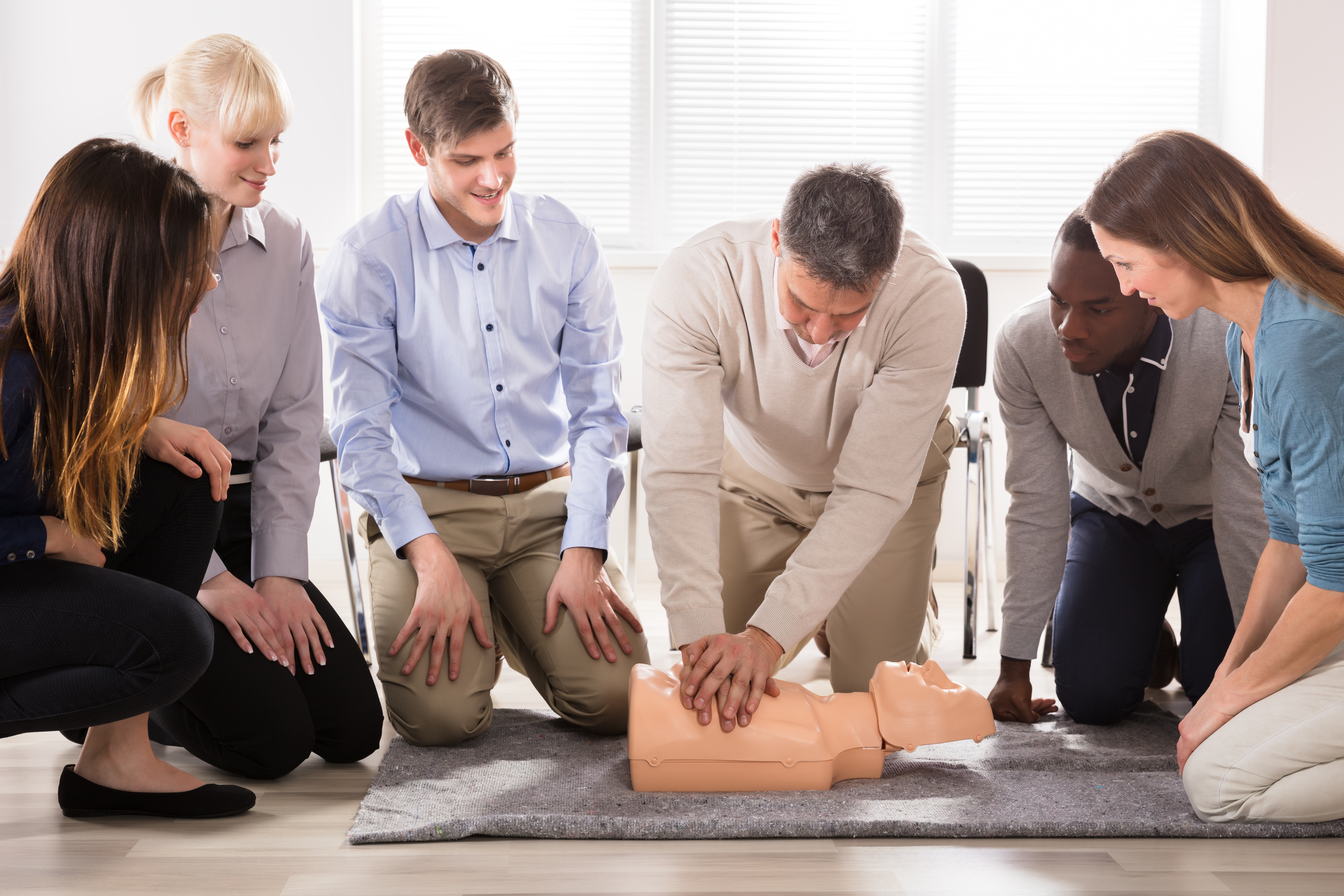 The Students Are Looking At The Instructor Performing Resuscitation Technique On Dummy for ACLS training