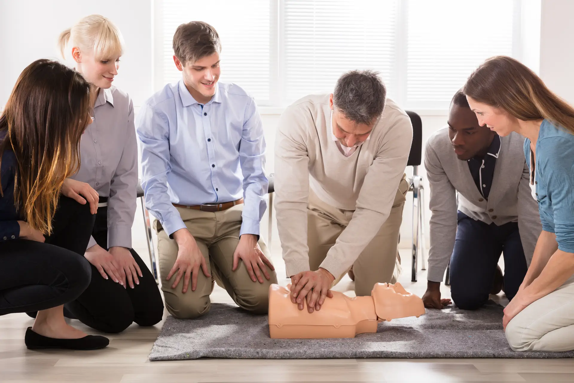 The Students Are Looking At The Instructor Performing Resuscitation Technique On Dummy for ACLS training