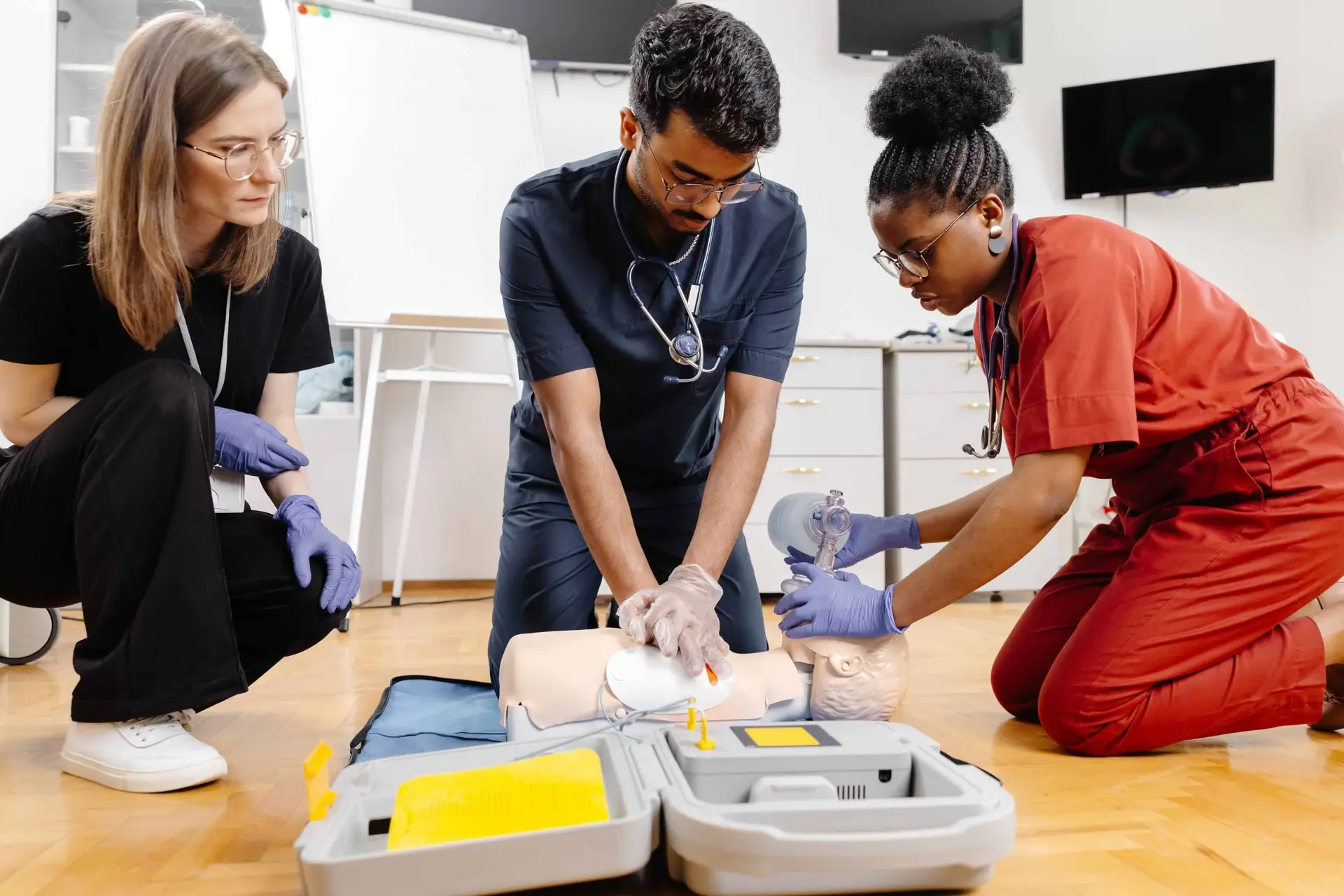 Healthcare professionals practicing airway positioning during BLS training session